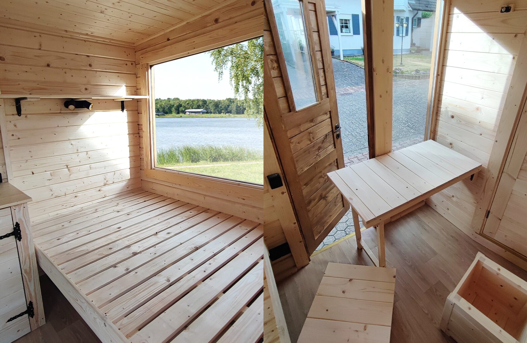 Interior view of a Feuerbad tiny house DELUXE with light wood paneling: on the left, a cozy sleeping area with a large window offering a view of a lake; on the right, the entrance area with an open wooden door, a foldable table, and compact seating and storage elements designed for flexible use.